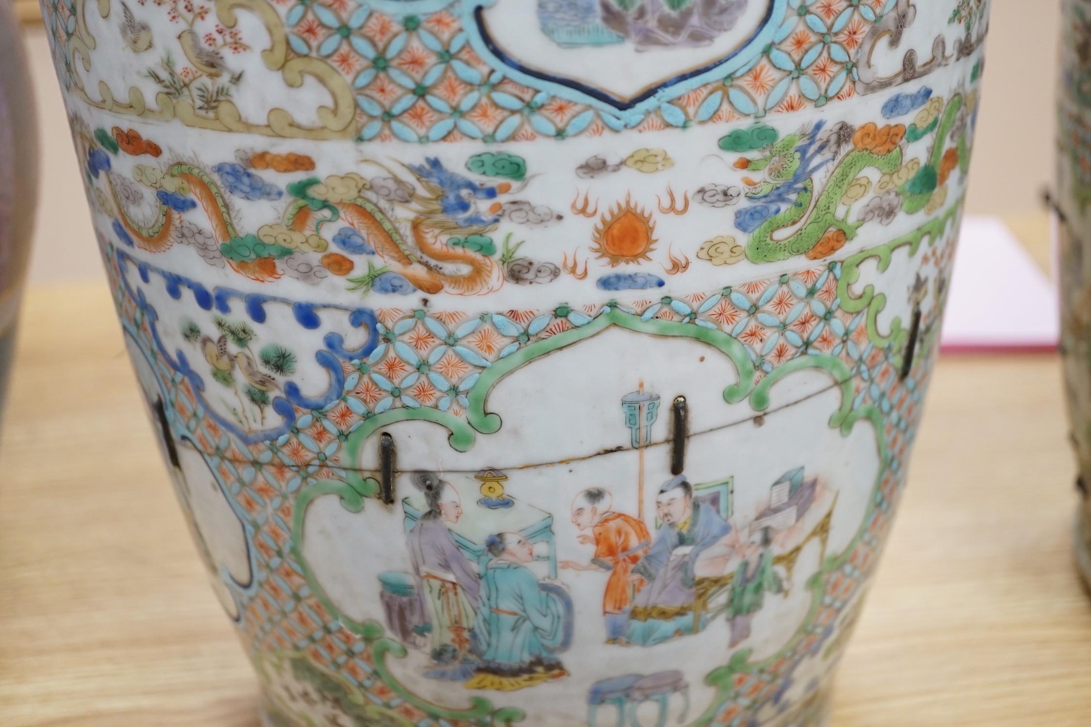 A large pair of Chinese export famille verte dragon vases (in need of restoration), 63cms high
